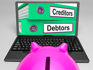 Image showing Creditors And Debtors Files On Laptop Shows Financing