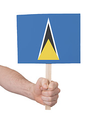 Image showing Hand holding small card - Flag of Saint Lucia