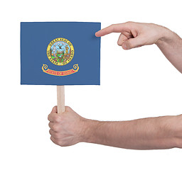 Image showing Hand holding small card - Flag of Idaho