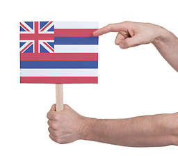 Image showing Hand holding small card - Flag of Hawaii