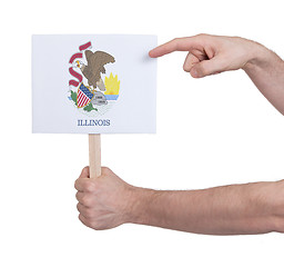 Image showing Hand holding small card - Flag of Illinois