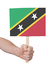 Image showing Hand holding small card - Flag of Saint Kitts and Nevis