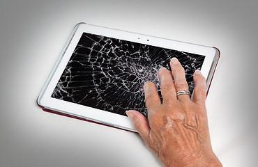 Image showing Senior lady with tablet, cracked screen