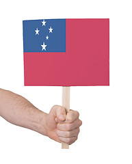 Image showing Hand holding small card - Flag of Samoa