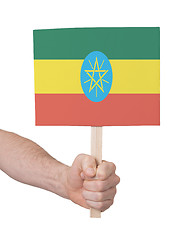 Image showing Hand holding small card - Flag of Ethiopia