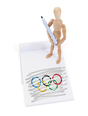 Image showing Wooden mannequin made a drawing - Olympic Rings