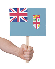 Image showing Hand holding small card - Flag of Fiji