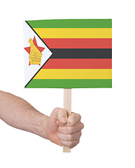 Image showing Hand holding small card - Flag of Zimbabwe