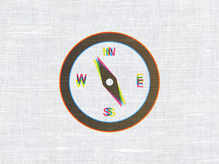 Image showing Vacation concept: Compass on fabric texture background