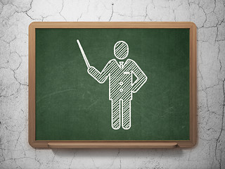 Image showing Learning concept: Teacher on chalkboard background