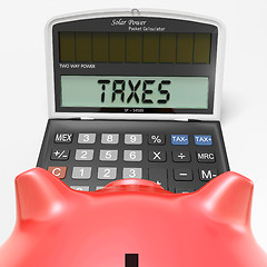 Image showing Taxes On Calculator Shows HMRC Return Due