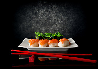 Image showing Sushi with chopsticks