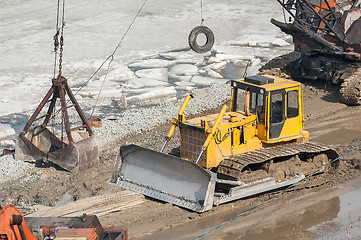 Image showing Bulldozer and crane on construction site