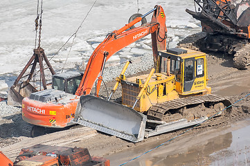 Image showing Bulldozer on quay construction site. Tyumen