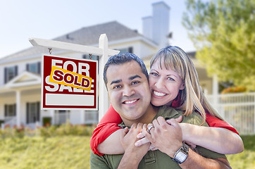 Image showing Couple in Front of Sold Real Estate Sign and House