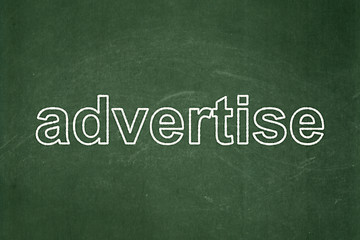 Image showing Marketing concept: Advertise on chalkboard background