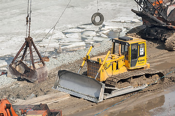 Image showing Bulldozer on quay construction site. Tyumen