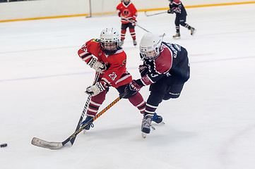 Image showing Game moment of children ice-hockey teams