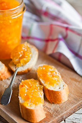 Image showing pieces of baguette with orange marmalade