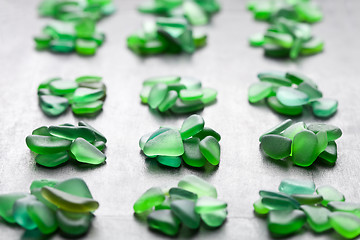 Image showing green pieces of glass polished by the sea 