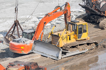 Image showing Bulldozer and crane on construction site