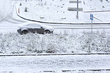 Image showing Car parked on snowy street