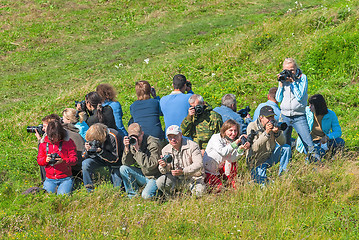 Image showing Photographers got up with equipment in a circle