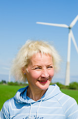 Image showing Portrait of a middle-aged woman on the background of wind-driven