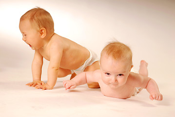 Image showing Babies lying on a ground
