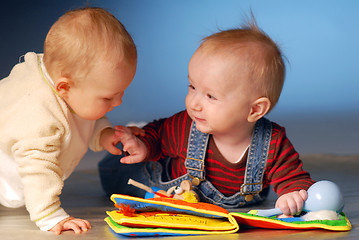 Image showing Babies playing with toys