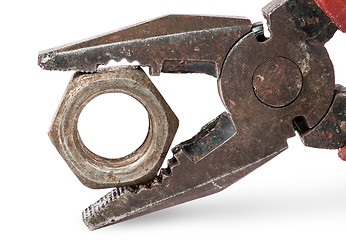 Image showing Closeup of old pliers and nut