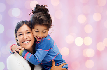 Image showing happy mother and daughter hugging