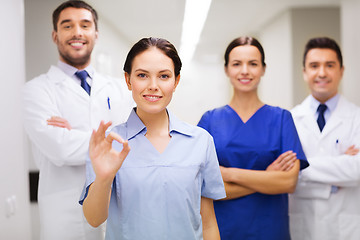 Image showing group of medics at hospital showing ok hand sign