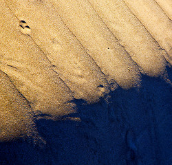 Image showing in   spain texture abstract of a  dry sand and the beach 