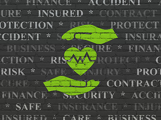 Image showing Insurance concept: Heart And Palm on wall background