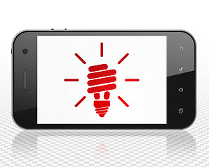 Image showing Business concept: Smartphone with Energy Saving Lamp on display