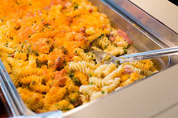 Image showing close up of pasta and spoon on catering tray