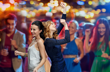 Image showing happy young women dancing at night club disco