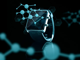 Image showing close up of smart watch over hydrogen formulas