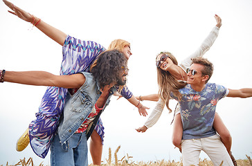 Image showing happy hippie friends having fun on cereal field