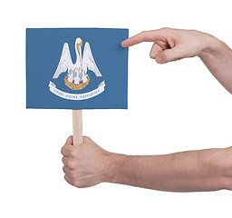 Image showing Hand holding small card - Flag of Louisiana