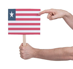 Image showing Hand holding small card - Flag of Liberia