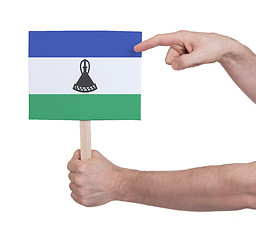 Image showing Hand holding small card - Flag of Lesotho