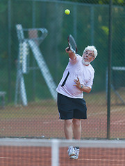 Image showing Senior man playing tennis