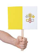 Image showing Hand holding small card - Flag of Vatican City