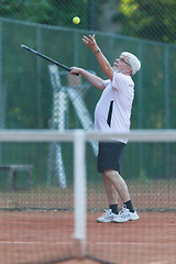 Image showing Senior man playing tennis