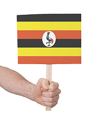 Image showing Hand holding small card - Flag of Uganda