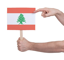 Image showing Hand holding small card - Flag of Lebanon