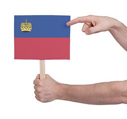 Image showing Hand holding small card - Flag of Liechtenstein