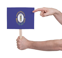 Image showing Hand holding small card - Flag of Kentucky